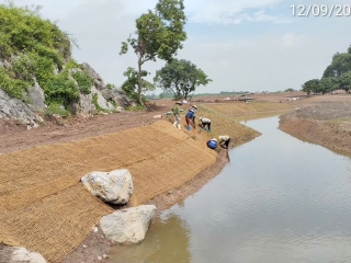 Coir nets are spread on the channel of the golf range